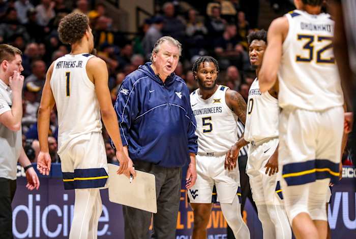 WVA coach Bob Huggins talks to his team during a timeout.